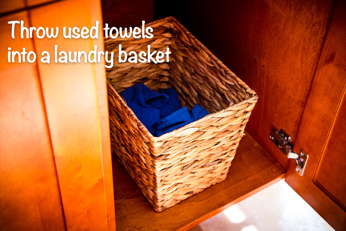 Throw your used cloth towels into a small laundry basket that you keep in the kitchen